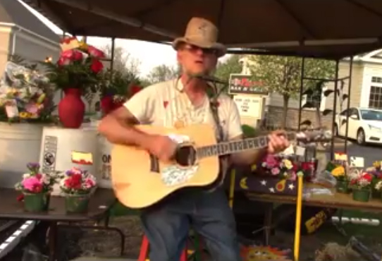 Chris Bihary sings about 45 years at flower stands